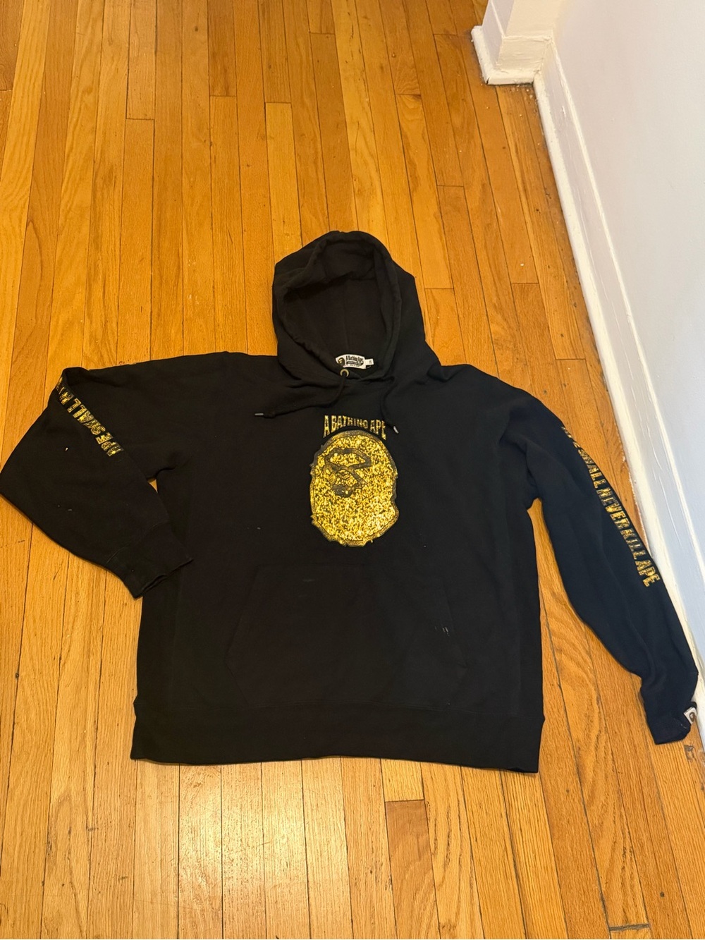 A Bathing Ape Black Hoodie with Yellow Ape Head Graphic
